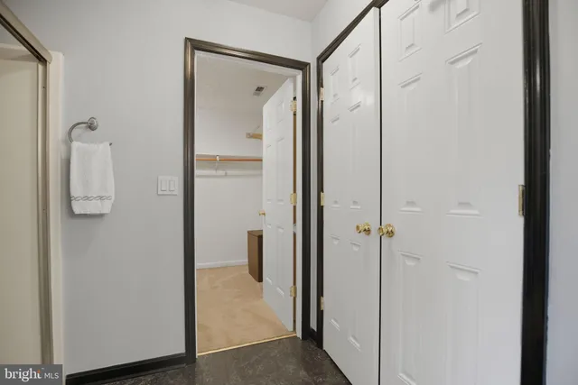 a bathroom with a shower and a glass door