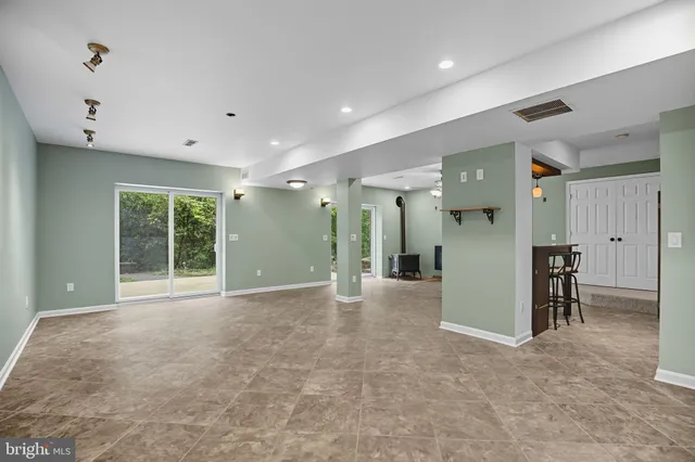 a bathroom with a shower and a sink