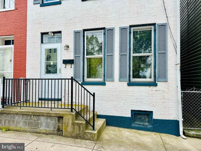 a view of a brick house with a window