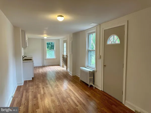a view of an empty room and glass door