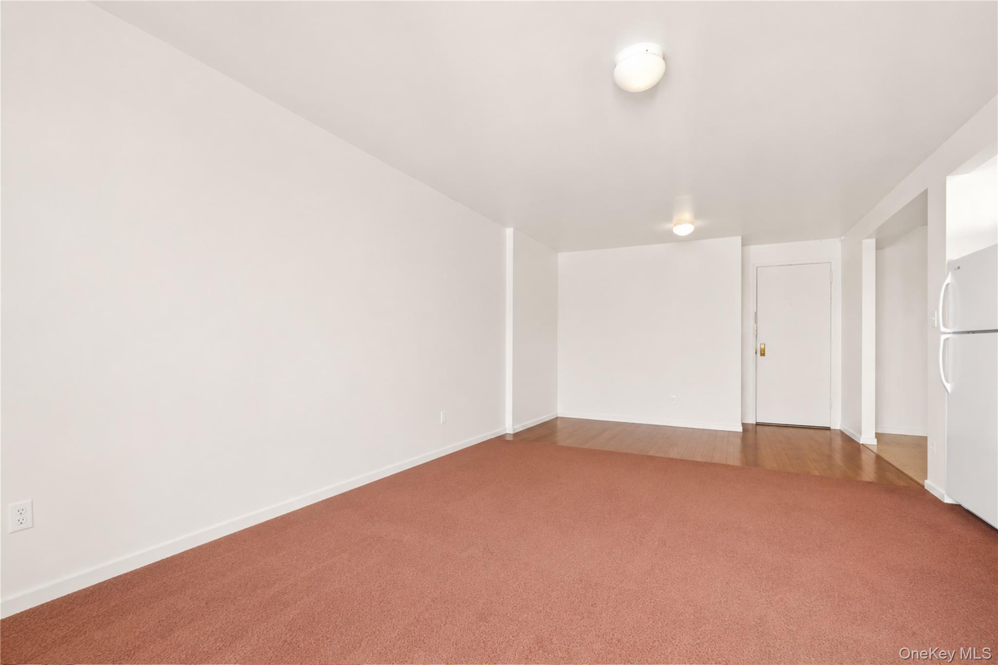 58-03 Calloway Street, Unit 5A Queens, NY 11368 - Photo 7 of 19 a view of an empty room with a window