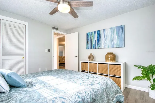 a spacious bedroom with a bed and a window