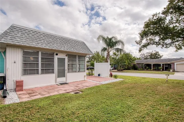 a front view of house with yard and seating space