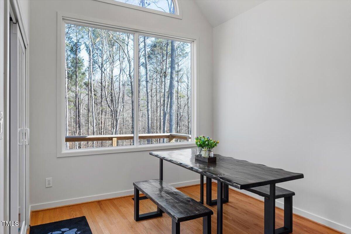 5920 Orchid Valley Road Raleigh, NC 27613 - Photo 25 of 54 Breakfast nook picture windows bring nature to you at all times