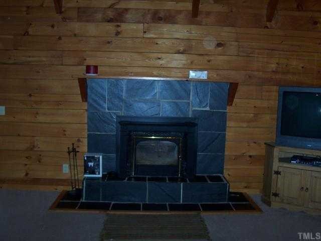 280 Indian Trail Road Timberlake, NC 27583 - Photo 6 of 11 a room with fireplace