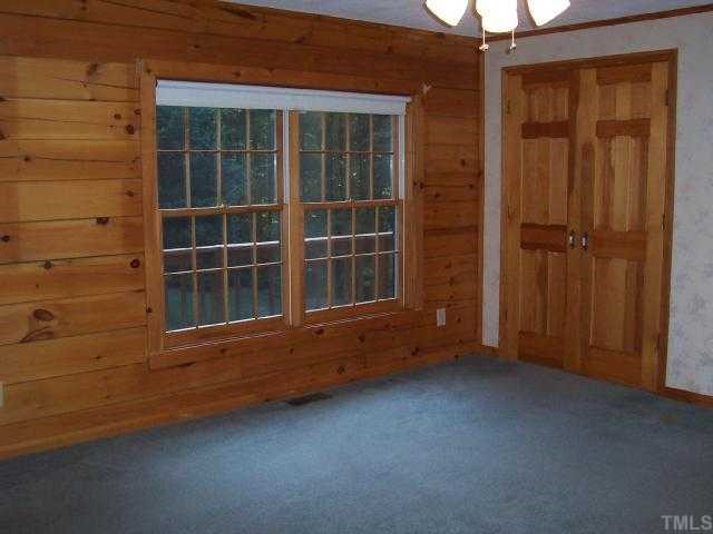 280 Indian Trail Road Timberlake, NC 27583 - Photo 7 of 11 an empty room with windows