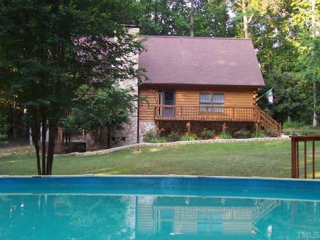280 Indian Trail Road Timberlake, NC 27583 - Photo 10 of 11 a view of a house with a yard and sitting area