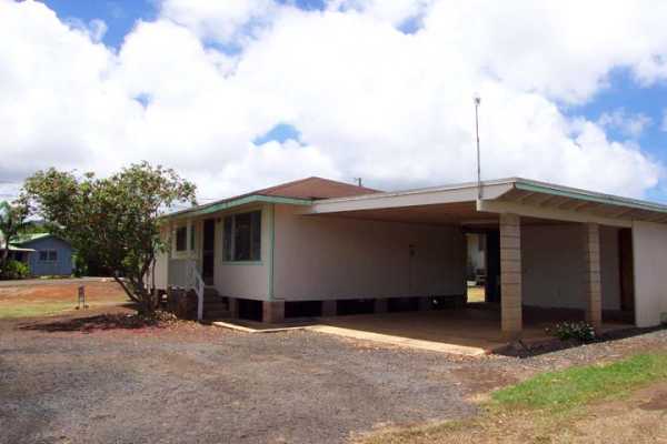 3369 Puni Road Koloa, HI 96756 - Photo 2 of 11 a view of a car park in front of a house