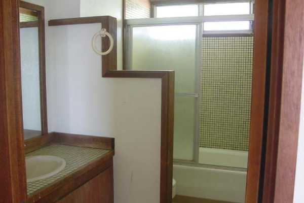 3369 Puni Road Koloa, HI 96756 - Photo 8 of 11 a bathroom with a sink a mirror and shower