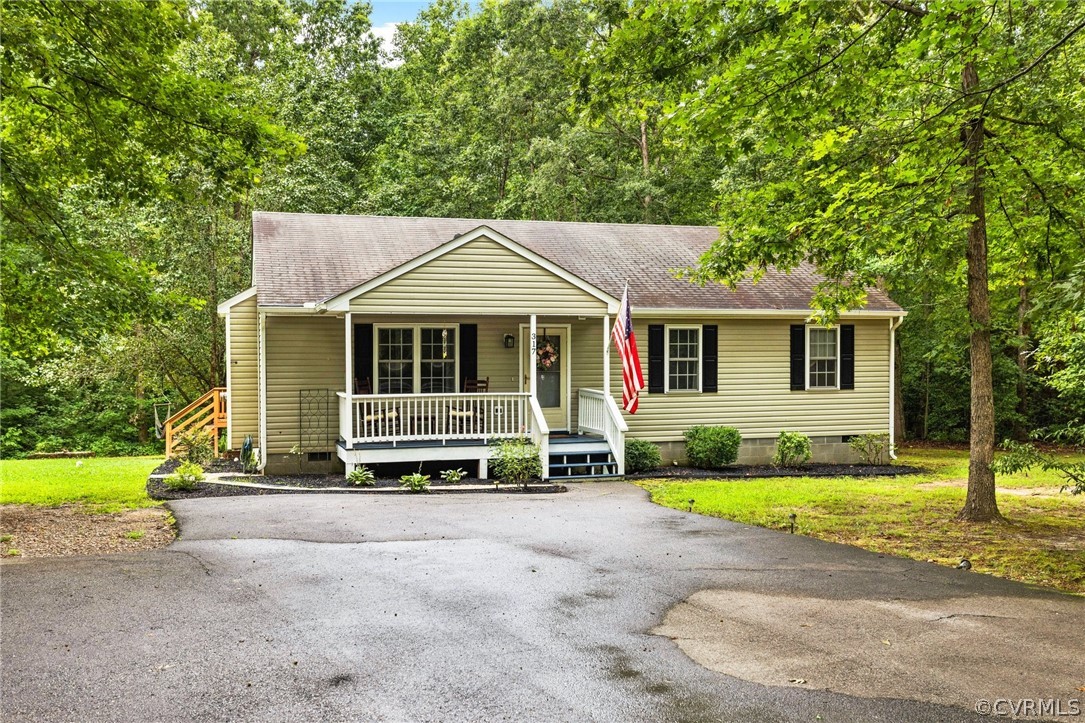 317 South Ridge Road Bumpass, VA 23024 - Photo 1 of 36 a house view with a garden space