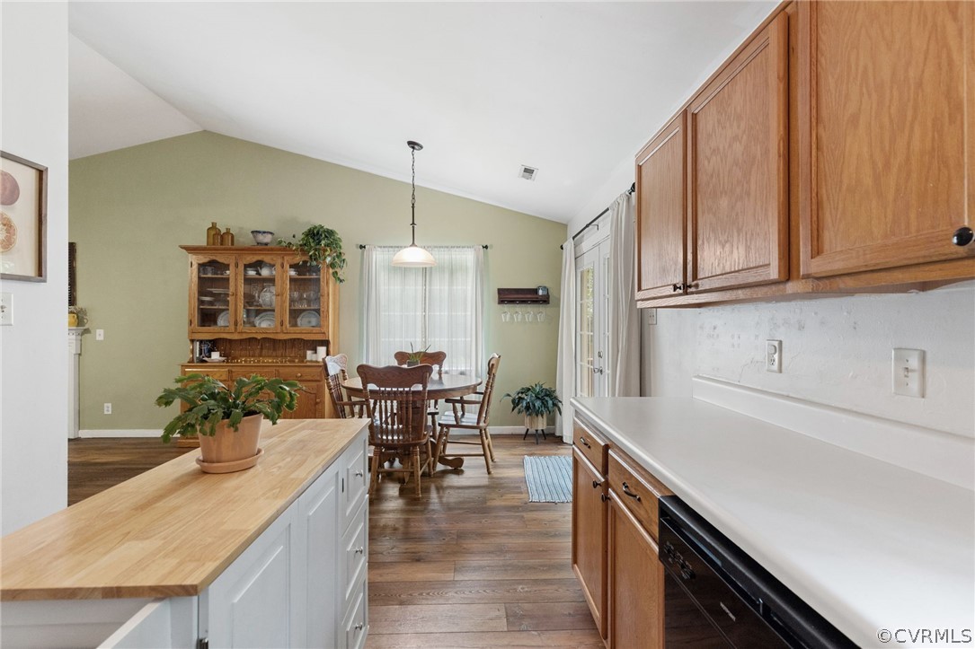 317 South Ridge Road Bumpass, VA 23024 - Photo 16 of 36 a kitchen with granite countertop a sink a stove and chairs