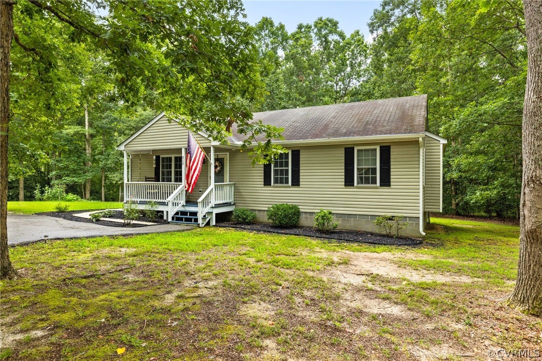 317 South Ridge Road Bumpass, VA 23024 - Photo 2 of 36 a view of a house with a yard patio and swimming pool