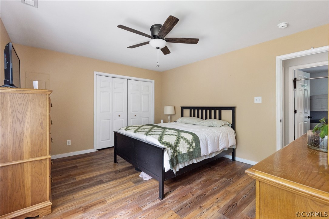317 South Ridge Road Bumpass, VA 23024 - Photo 21 of 36 a spacious bedroom with a bed and a table