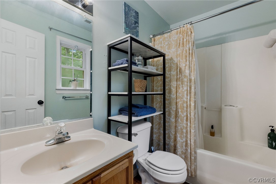317 South Ridge Road Bumpass, VA 23024 - Photo 23 of 36 a bathroom with a sink toilet and shower