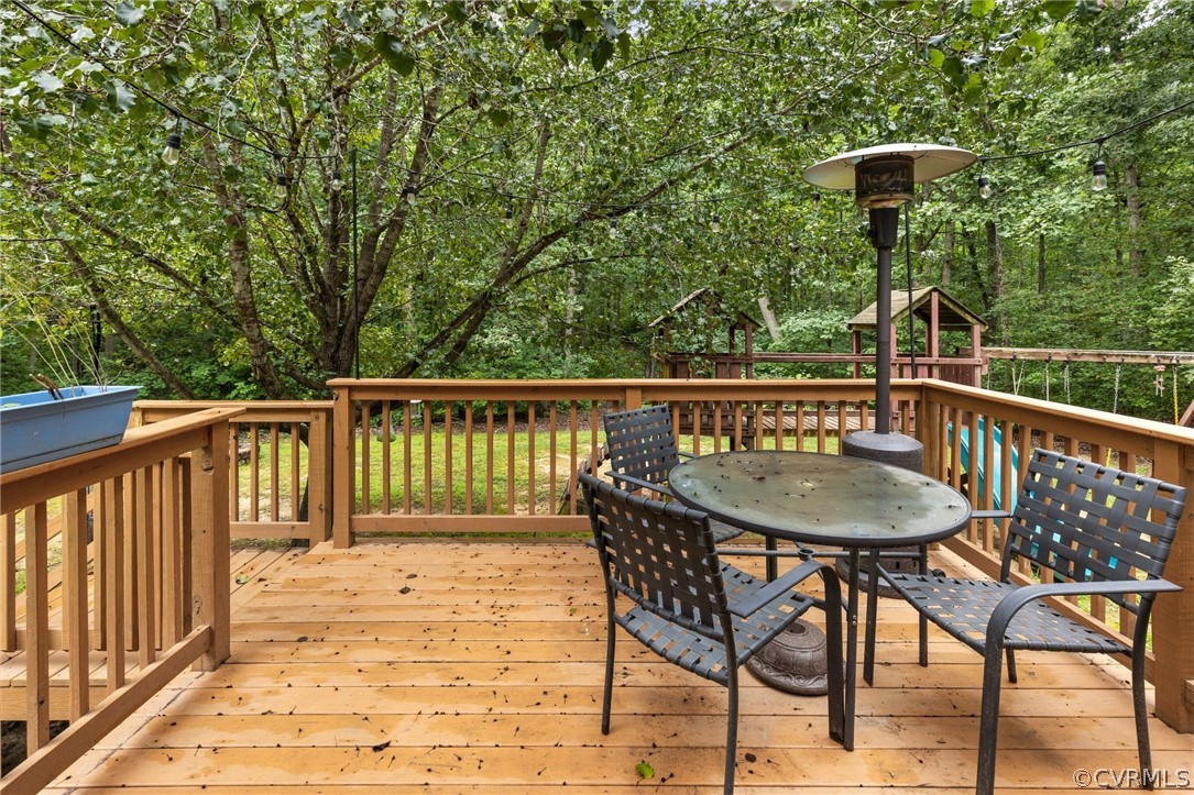 317 South Ridge Road Bumpass, VA 23024 - Photo 25 of 36 a view of a wooden chairs and table on the deck