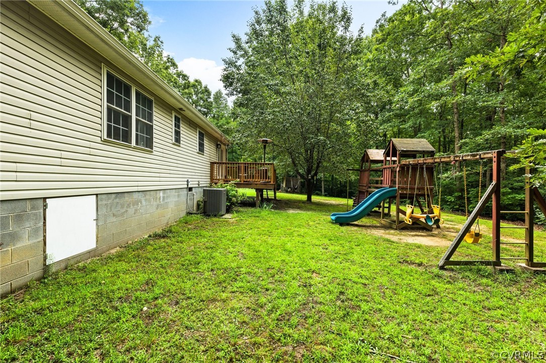 317 South Ridge Road Bumpass, VA 23024 - Photo 27 of 36 a view of a house with a backyard and a slide