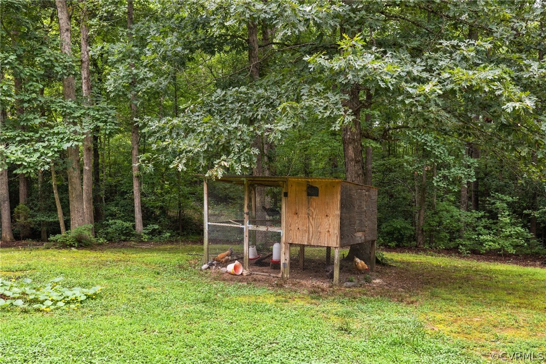 317 South Ridge Road Bumpass, VA 23024 - Photo 29 of 36 a view of a wooden deck and a backyard