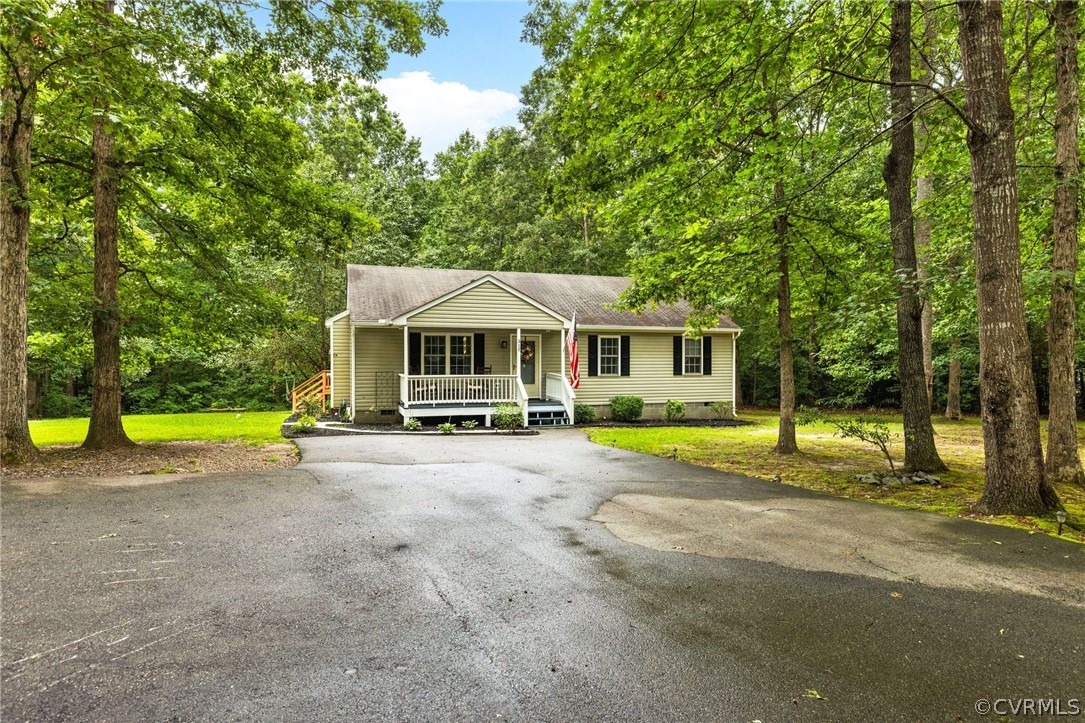 317 South Ridge Road Bumpass, VA 23024 - Photo 3 of 36 a view of house with swimming pool outdoor seating and yard