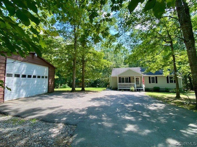 317 South Ridge Road Bumpass, VA 23024 - Photo 35 of 36 a front view of a house with a yard and trees