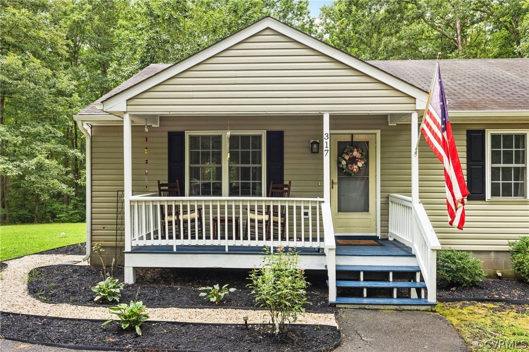 317 South Ridge Road Bumpass, VA 23024 - Photo 4 of 36 a front view of a house with porch
