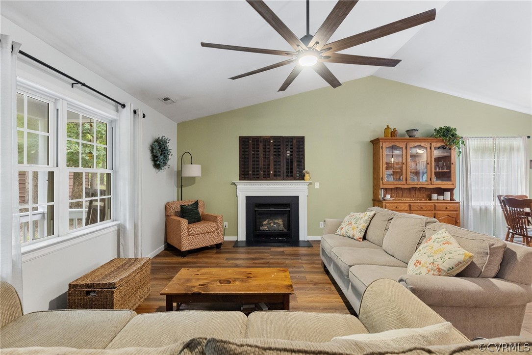 317 South Ridge Road Bumpass, VA 23024 - Photo 6 of 36 a living room with furniture fireplace and a large window