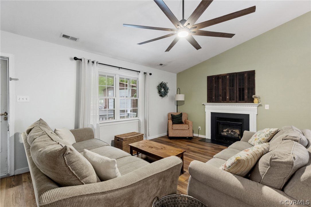 317 South Ridge Road Bumpass, VA 23024 - Photo 7 of 36 a living room with furniture and a fireplace