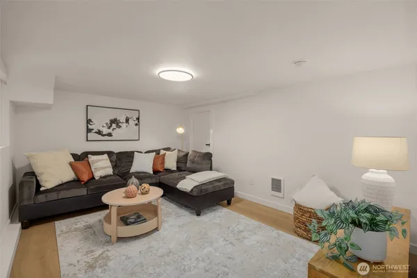 a living room with furniture and a rug