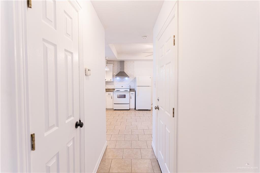 616 Jade Street Edinburg, TX 78541 - Photo 11 of 17 a view of a hallway with two white cabinets