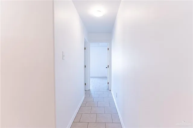 a view of a bathroom from a hallway