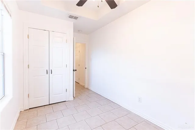 a view of a room with white walls