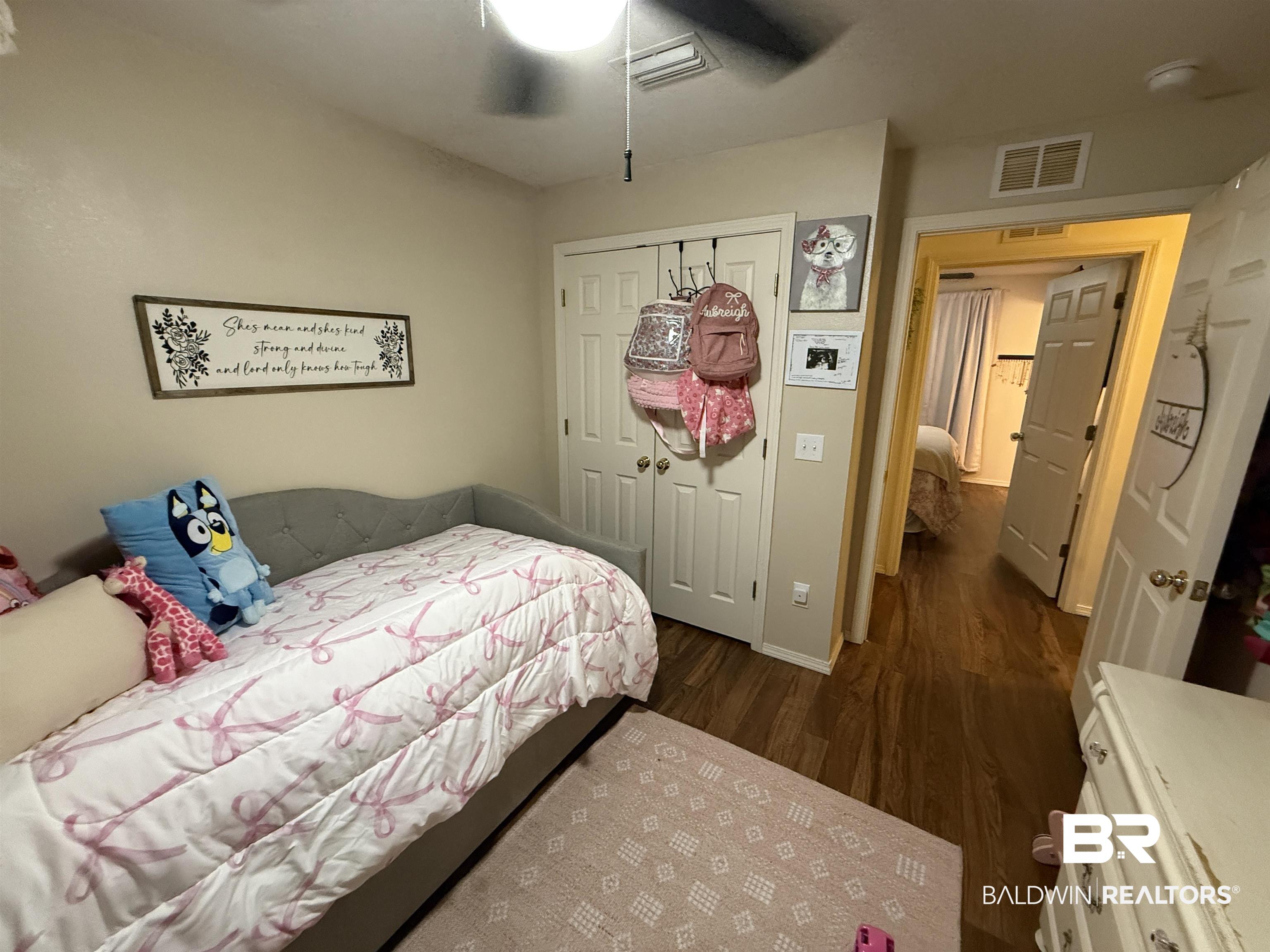 820 Fannie Road Century, FL 32535 - Photo 26 of 29 Bedroom with dark wood finished floors, a closet, and ceiling fan