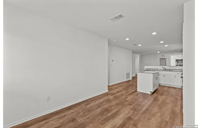 a view of kitchen and wooden floor
