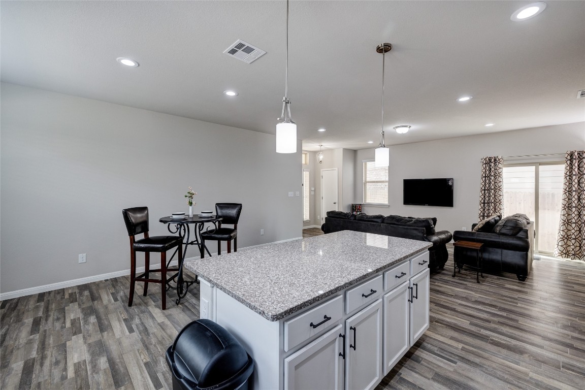 128 Shearwater Lane Leander, TX 78641 - Photo 29 of 30 a kitchen with a stove and chairs