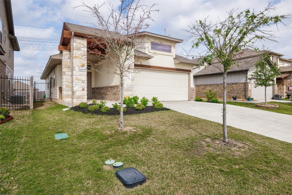 128 Shearwater Lane Leander, TX 78641 - Photo 2 of 30 a house view with a garden space
