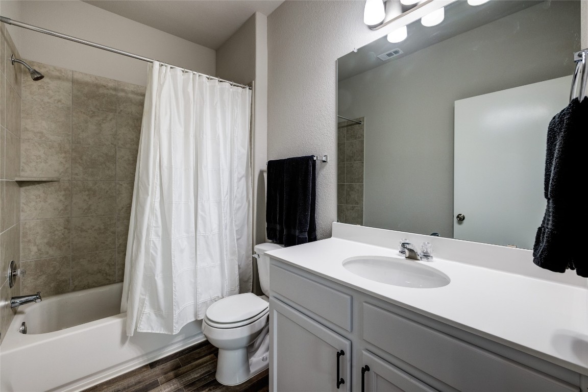 128 Shearwater Lane Leander, TX 78641 - Photo 19 of 30 a bathroom with a sink toilet and shower