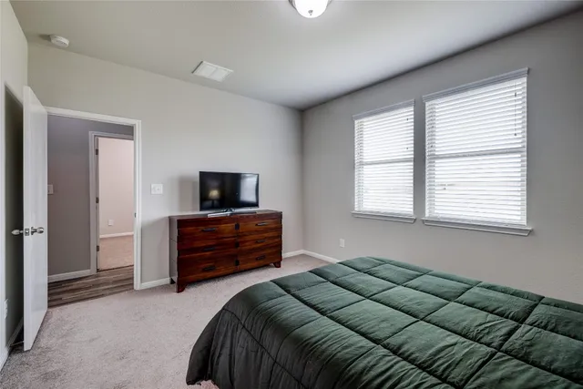 a workspace room with furniture and wooden floor