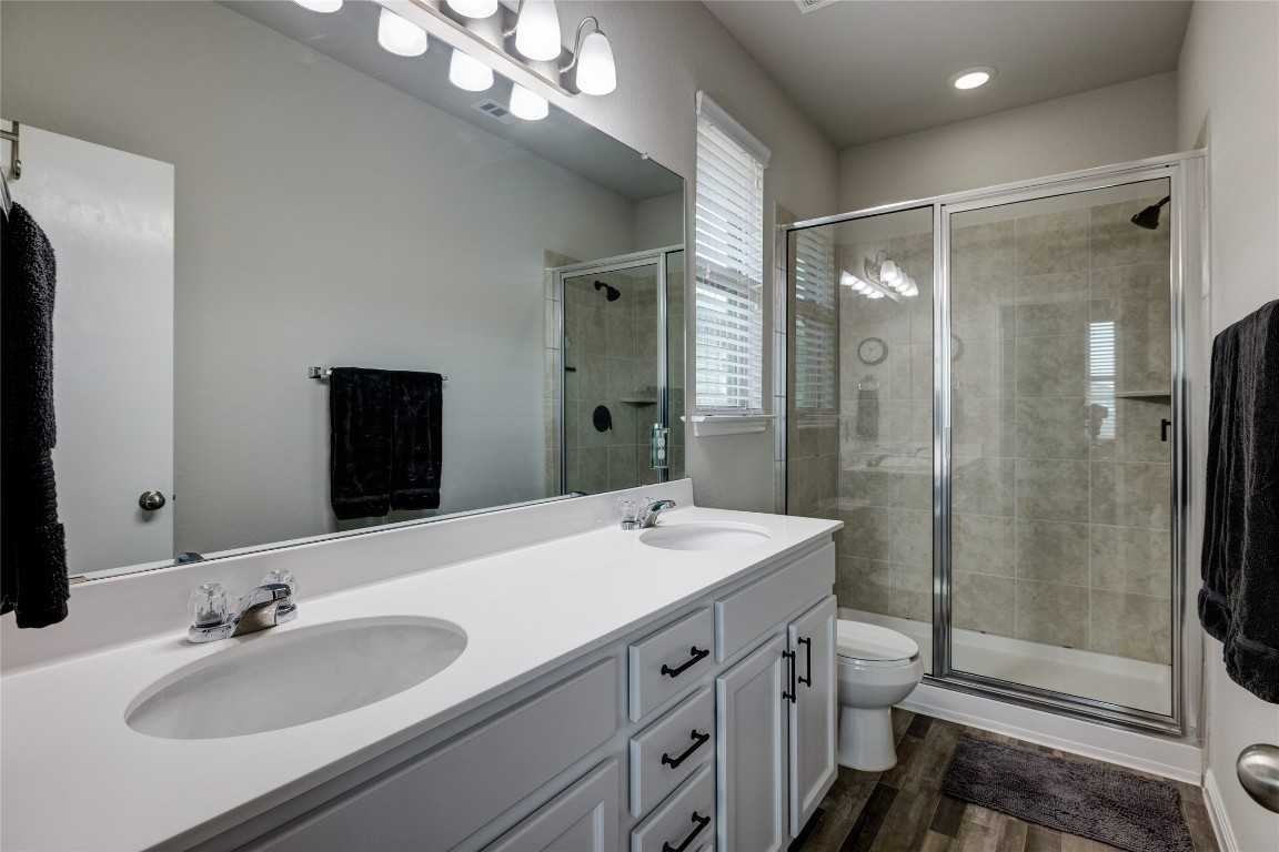 128 Shearwater Lane Leander, TX 78641 - Photo 24 of 30 a bathroom with a sink double vanity and a mirror