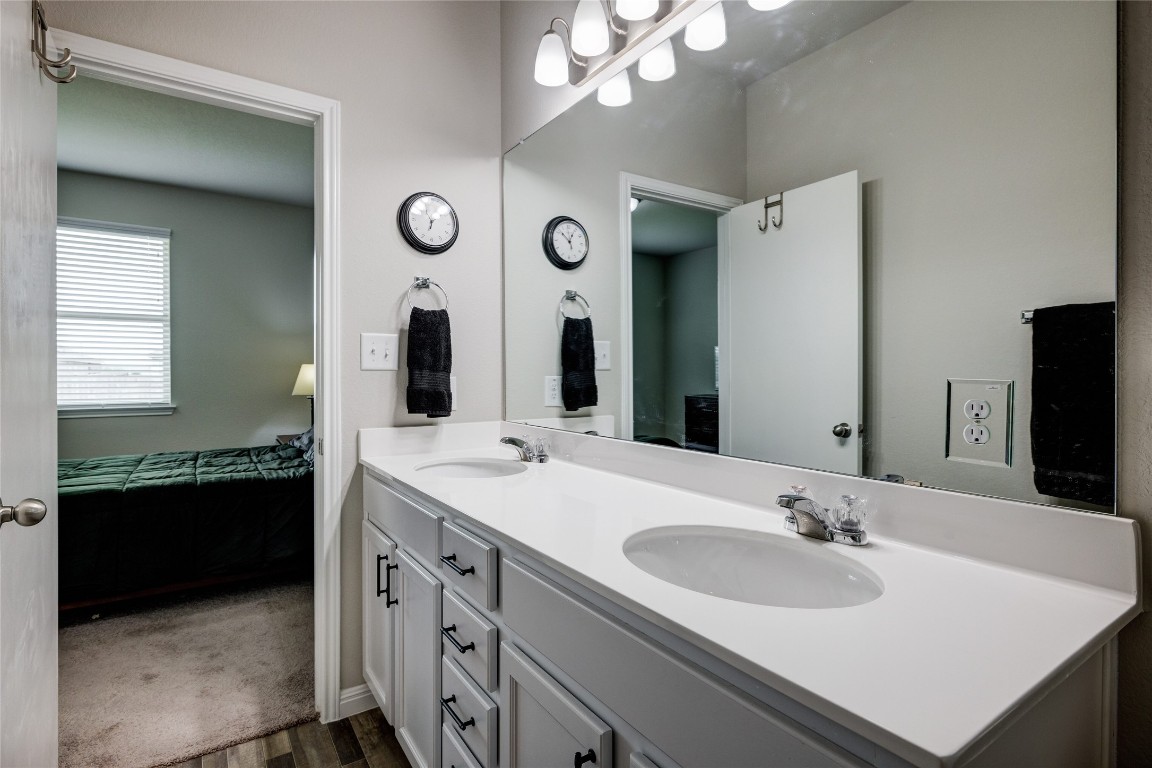 128 Shearwater Lane Leander, TX 78641 - Photo 25 of 30 a bathroom with a sink vanity and a mirror