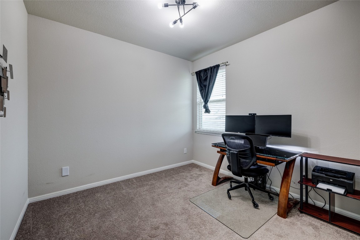 128 Shearwater Lane Leander, TX 78641 - Photo 26 of 30 a view of workspace with wooden floor and piano