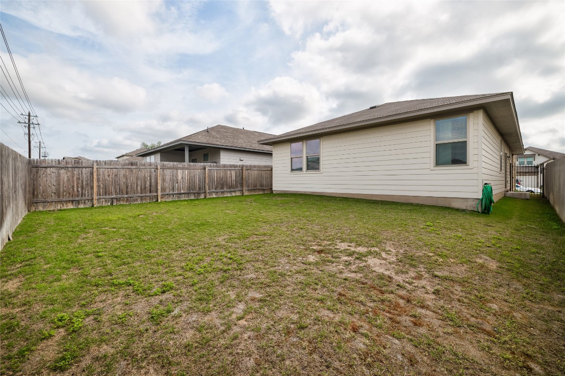 128 Shearwater Lane Leander, TX 78641 - Photo 6 of 30 a view of a yard in front of a house with a large tree
