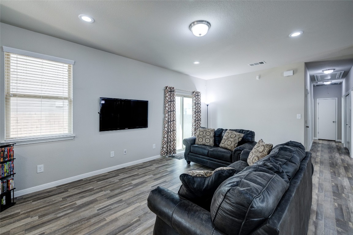 128 Shearwater Lane Leander, TX 78641 - Photo 9 of 30 a living room with furniture and a flat screen tv
