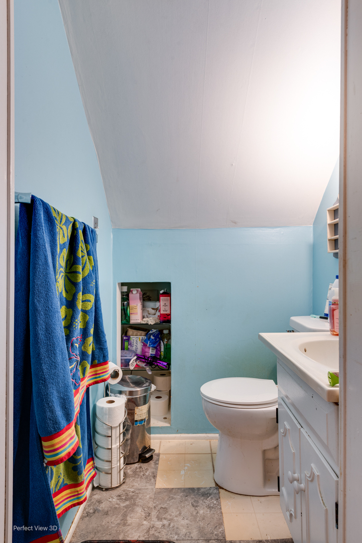 1020 Black Road Joliet, IL 60435 - Photo 14 of 18 a bathroom with a toilet sink and mirror