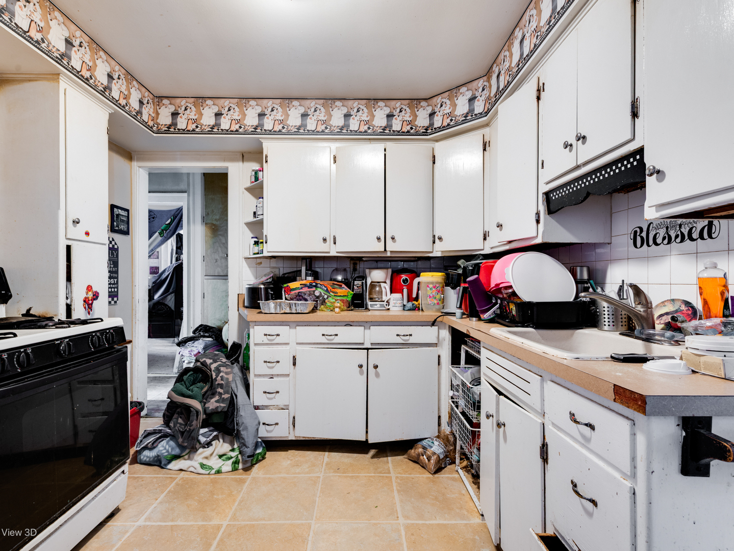 1020 Black Road Joliet, IL 60435 - Photo 5 of 18 a kitchen with a sink dishwasher and white cabinets