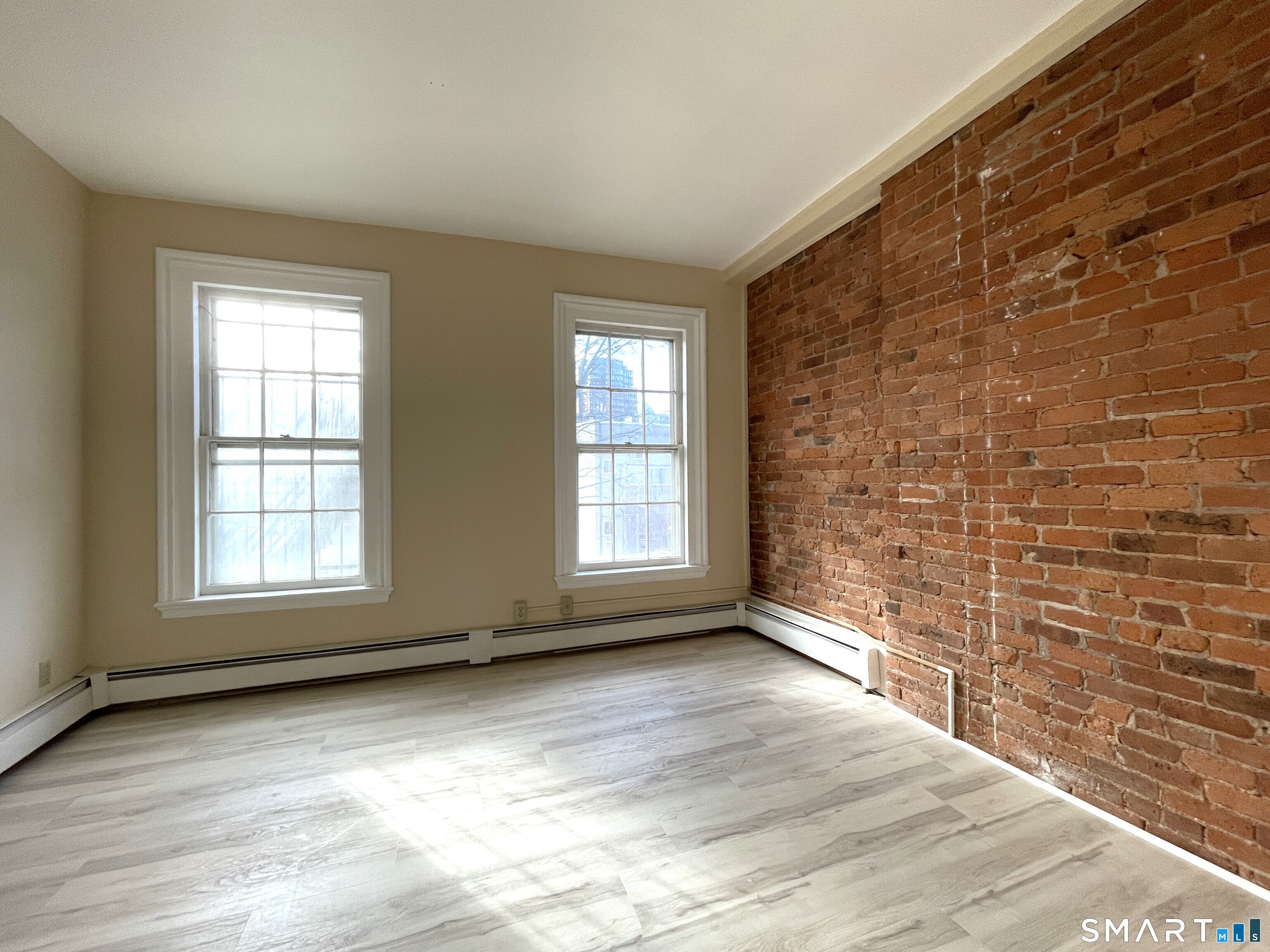 32 Trumbull Street, Unit 3 New Haven, CT 06511 - Photo 8 of 8 a view of an empty room with a window