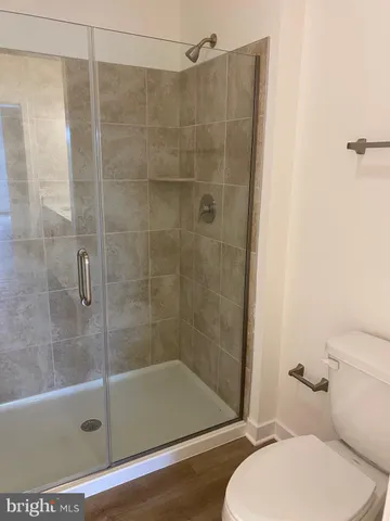 a bathroom with double vanity sinks and a mirror