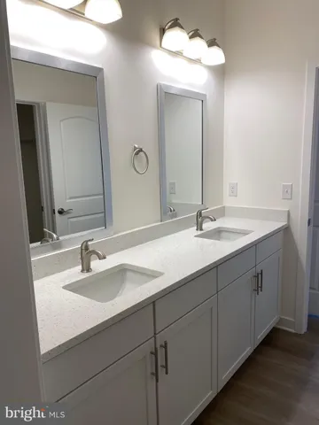 a view of a room with wooden floor and floor to ceiling window