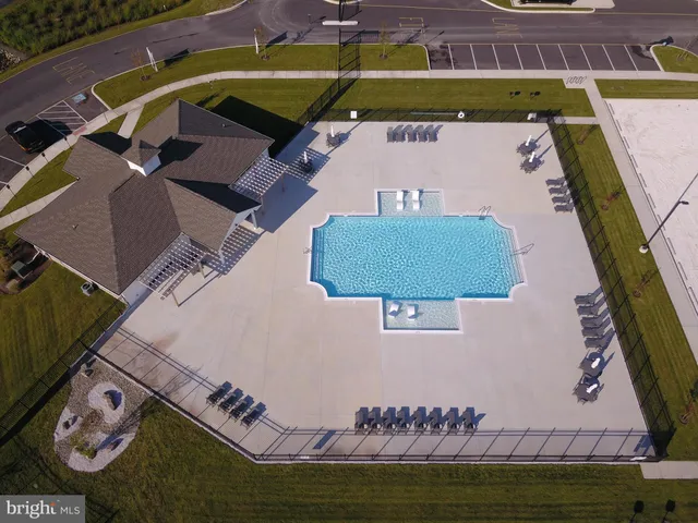a view of a swimming pool with a lake view
