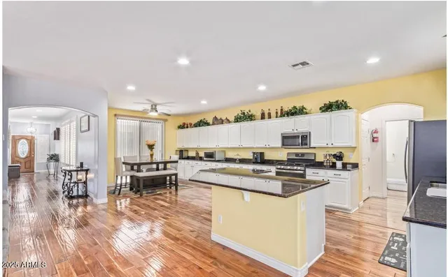 a bathroom with a shower and a glass door