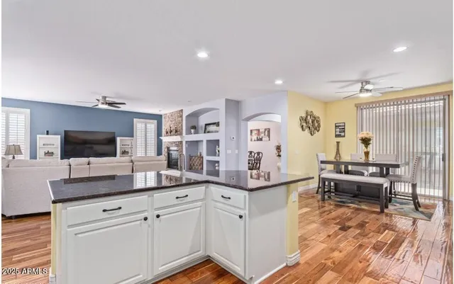 a view of a livingroom with workspace and a window