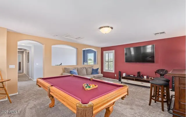 a kitchen with stainless steel appliances granite countertop a refrigerator stove microwave and sink